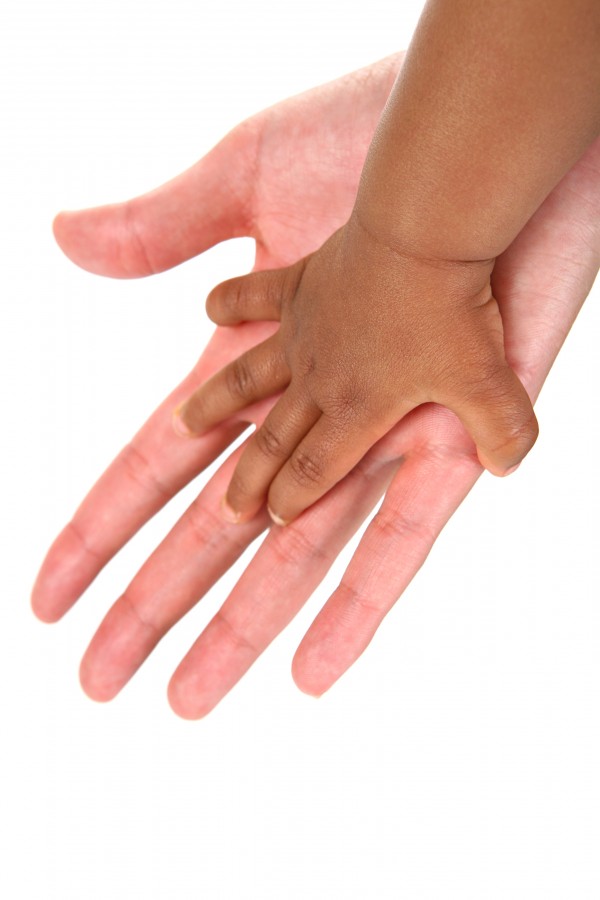 hands of mother and adopted child