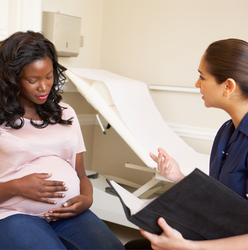 Pregnant Woman With Counselor